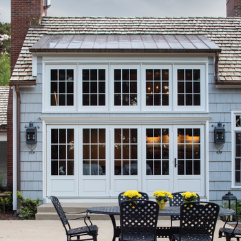 Curbside of home with 10 windows