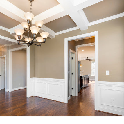 MillworkWhite trim around doors, floor, and ceiling of a home